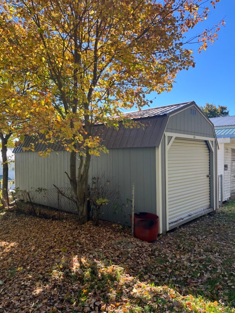 Gray private storage shed with metal roof and front roll-up door in Mahanoy City area, Pennsylvania